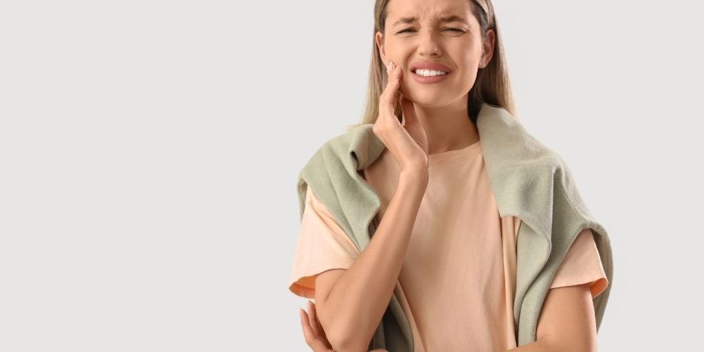 Dentist in Fair Oaks, VA examining patient with tooth pain